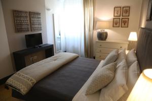 Uma cama ou camas num quarto em Palazzo Bignami