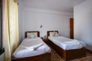 Letto o letti in una camera di Pacific Guest House