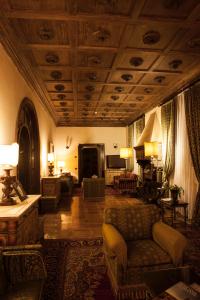 a living room with a couch and a table at Hotel La Collegiata - Adults Only in San Gimignano