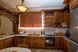 Kuchyň nebo kuchyňský kout v ubytování Paradise Bar Apartments