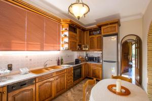Kuchyň nebo kuchyňský kout v ubytování Paradise Bar Apartments