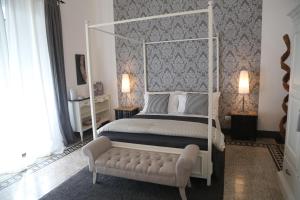 Uma cama ou camas num quarto em Palazzo Bignami
