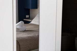 Krevet ili kreveti u jedinici u okviru objekta Hotel della Contrada
