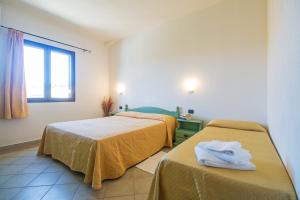 Postel nebo postele na pokoji v ubytování Albergo Residenziale Gli Ontani