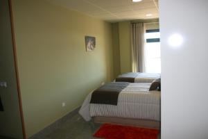 Postel nebo postele na pokoji v ubytování Apartamento "CAMPO CARMEN"