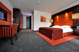 Postel nebo postele na pokoji v ubytování Van der Valk Hotel Hilversum/ De Witte Bergen