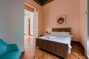 Postel nebo postele na pokoji v ubytování Hostal R10
