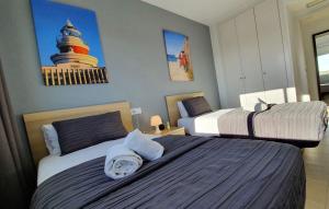 Cama o camas de una habitación en Salou Med Apartamentos