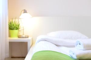 Łóżko lub łóżka w pokoju w obiekcie WenderEDU Business Center