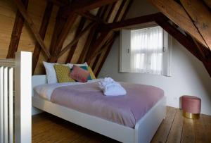 Voodi või voodid majutusasutuse Haarlem Hotel Suites toas
