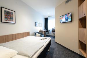Ένα ή περισσότερα κρεβάτια σε δωμάτιο στο Egon Hotel Hamburg City
