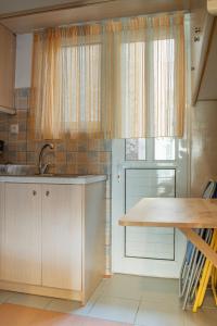 Kuchyňa alebo kuchynka v ubytovaní Fix Divine Apartment