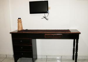 TV in/ali zabaviščno središče v nastanitvi Hotel & Hostal Yaxkin Copan