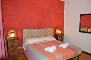 A bed or beds in a room at Betty's House