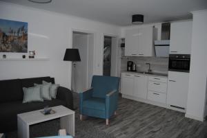 Kuchyň nebo kuchyňský kout v ubytování Dünenrose Apartment 7