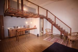 a room with a staircase and a table and chairs at Soy Local Centro Histórico in Cartagena de Indias