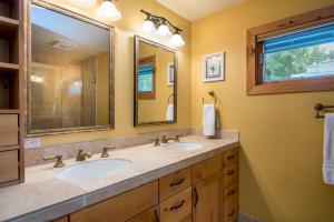 a bathroom with two sinks and a large mirror at Sage Road 415A in Ketchum +17 photos