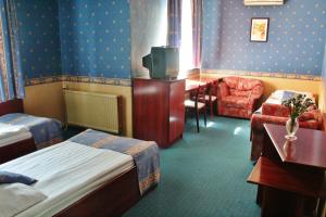 Postel nebo postele na pokoji v ubytování Classic Hotel