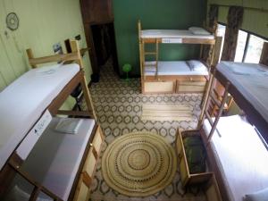 Un ou plusieurs lits dans un hébergement de l'établissement Hostel Casa de las Palmas Tours