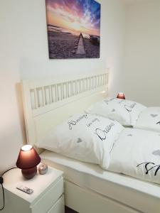 a bedroom with two white pillows on a bed at Ferienwohnung Cifci in Friedrichshafen
