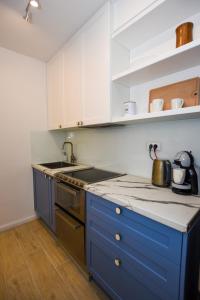 Kuchyň nebo kuchyňský kout v ubytování Apartments Villa Laura