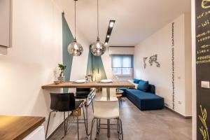 a kitchen and dining room with a table and chairs at Ports Crossroad A in Piraeus