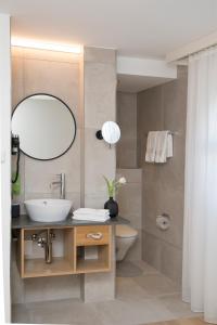 Kamar mandi di Businesshotel Forum Widnau