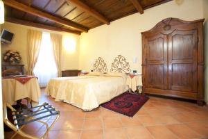 Postel nebo postele na pokoji v ubytování Hotel Palazzo Di Mezzo