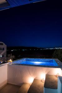 The swimming pool at or close to White & Blue