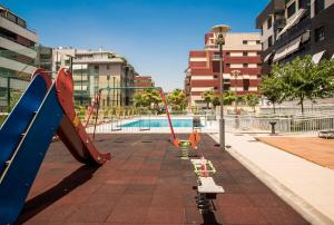 The swimming pool at or close to EnjoyGranada LUJO Piscina y Parking