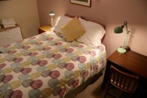 A bed or beds in a room at Mancos Inn