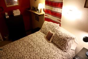 A bed or beds in a room at Mancos Inn