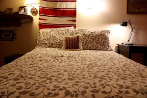 A bed or beds in a room at Mancos Inn
