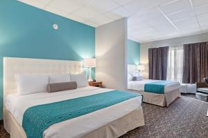 Elevation Inn & Suites, Trademark Collection by Wyndham客房内的一张或多张床位