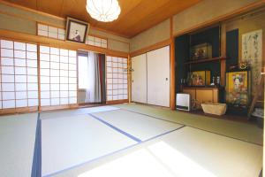 an empty room with a large blue floor at I Osaka Traditional in Osaka
