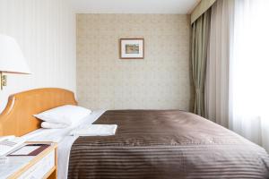 Postel nebo postele na pokoji v ubytování Hotel Okura Niigata