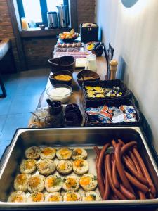 a buffet of food with hot dogs and other foods at JEZ&SPI Plánice in Plánice