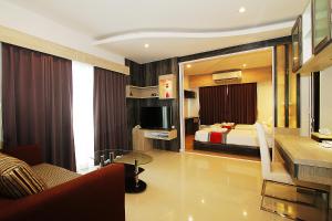 Ένα ή περισσότερα κρεβάτια σε δωμάτιο στο The Contrast i Hotel