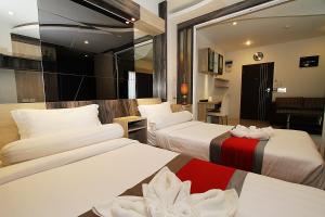 Ένα ή περισσότερα κρεβάτια σε δωμάτιο στο The Contrast i Hotel