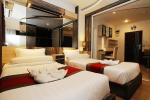Ένα ή περισσότερα κρεβάτια σε δωμάτιο στο The Contrast i Hotel