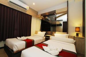 Ένα ή περισσότερα κρεβάτια σε δωμάτιο στο The Contrast i Hotel