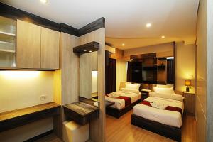 Ένα ή περισσότερα κρεβάτια σε δωμάτιο στο The Contrast i Hotel