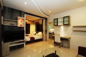 Ένα ή περισσότερα κρεβάτια σε δωμάτιο στο The Contrast i Hotel