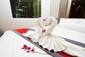 Ένα ή περισσότερα κρεβάτια σε δωμάτιο στο The Contrast i Hotel