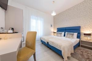 Postel nebo postele na pokoji v ubytování San Martino Rooms