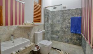 a bathroom with a toilet and a sink and a shower at Athena Lake in Dambulla