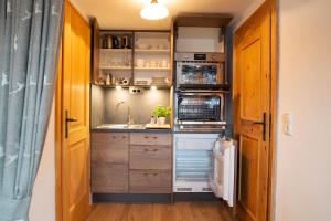 Küche/Küchenzeile in der Unterkunft Rostalm