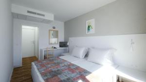 Postel nebo postele na pokoji v ubytování Hotel Erma