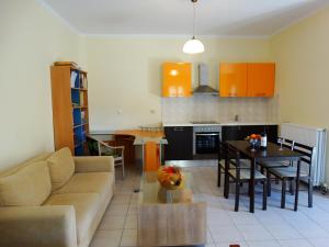 a living room with a couch and a table at Angela apartments in Lefkada Town
