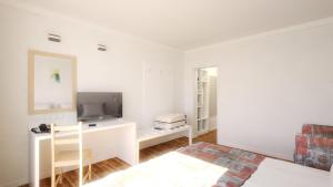 TV a/nebo společenská místnost v ubytování Hotel Erma